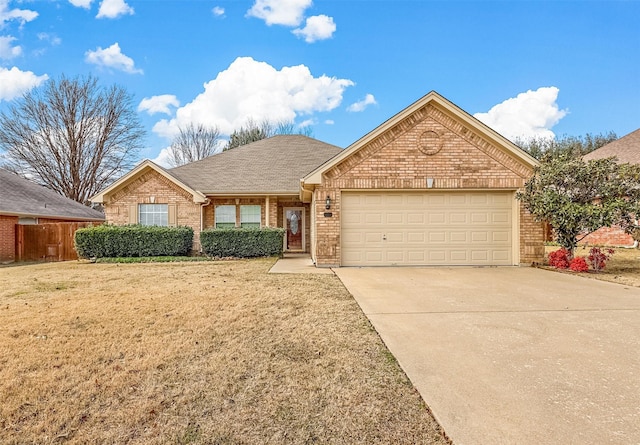 view of front of home with a front yard and a garage