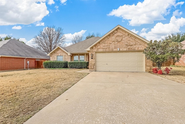 view of front of property with a front lawn and a garage