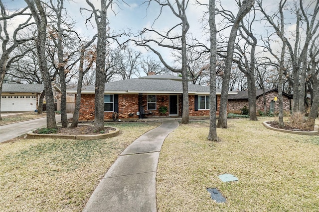 ranch-style house with a front lawn and a garage