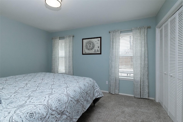 carpeted bedroom with a closet