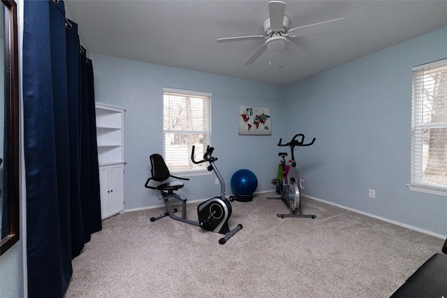 workout area with carpet floors, a wealth of natural light, and ceiling fan