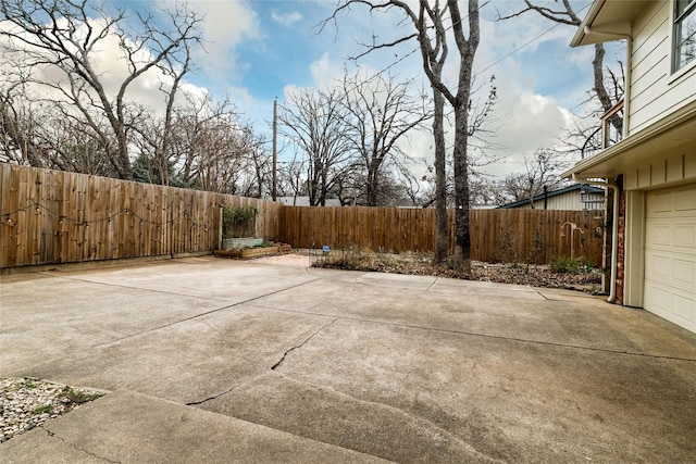 view of patio featuring a garage