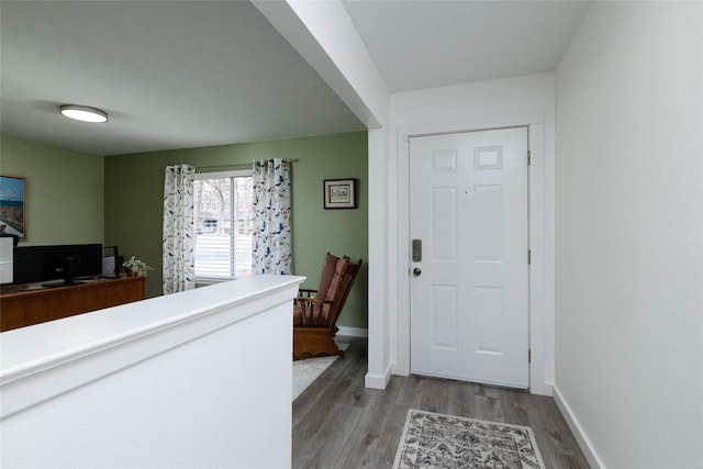 foyer entrance with hardwood / wood-style floors