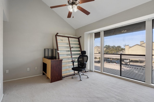 carpeted office with ceiling fan and high vaulted ceiling