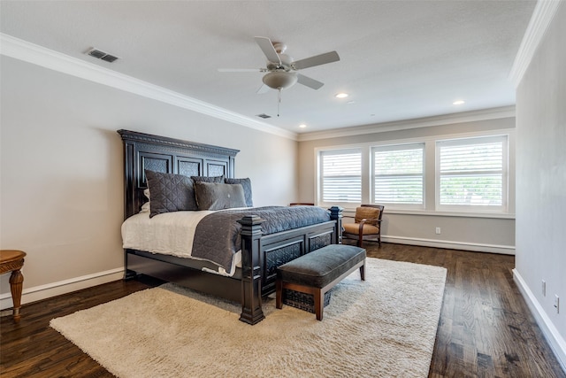 bedroom with ceiling fan, dark hardwood / wood-style flooring, and crown molding