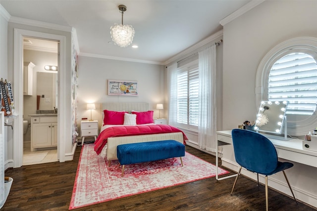 bedroom featuring dark hardwood / wood-style floors, crown molding, and connected bathroom