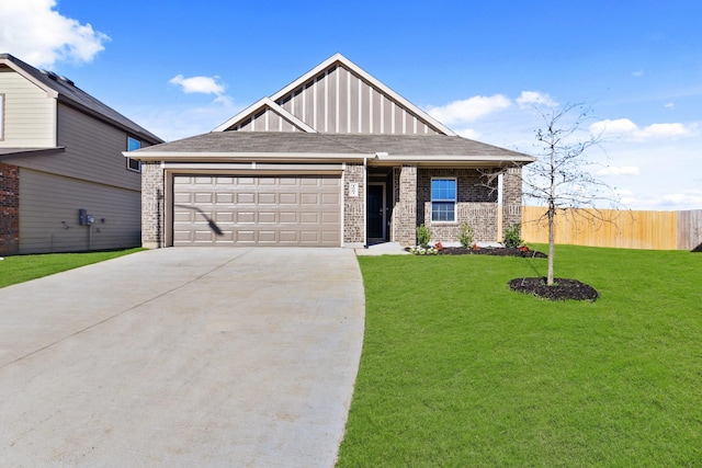 view of front of property featuring a garage and a front yard