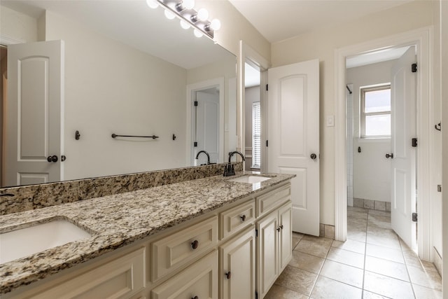 bathroom featuring vanity and tile patterned flooring