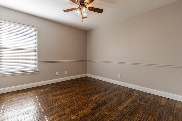 spare room with ceiling fan, plenty of natural light, and dark hardwood / wood-style flooring