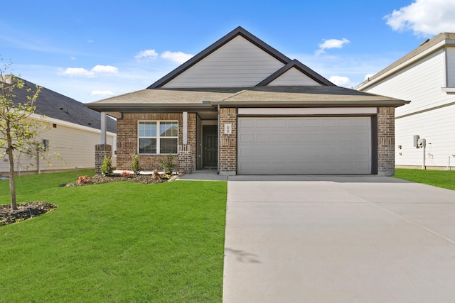 view of front of home with a garage and a front lawn