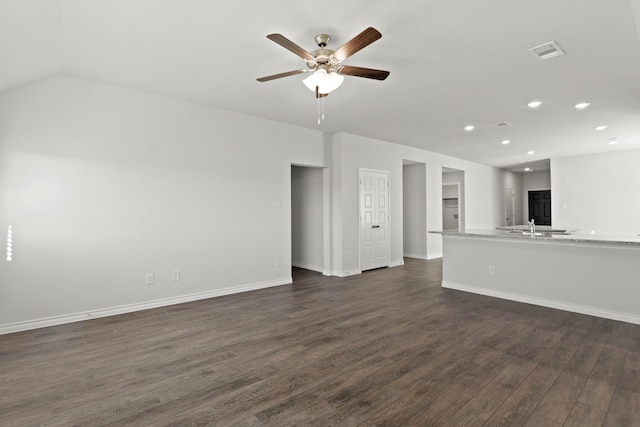 unfurnished living room with ceiling fan, dark wood-type flooring, and sink