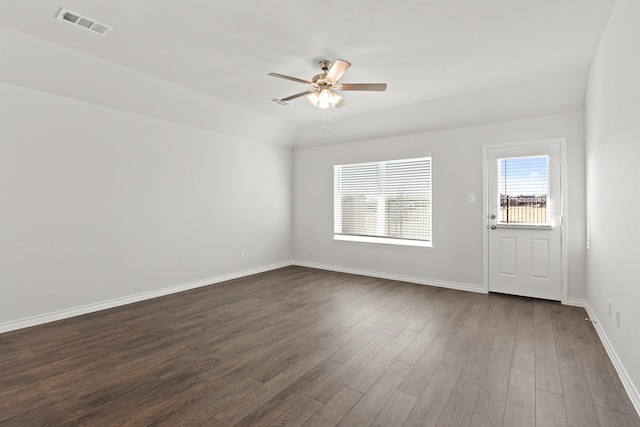 empty room featuring ceiling fan, dark hardwood / wood-style flooring, and lofted ceiling