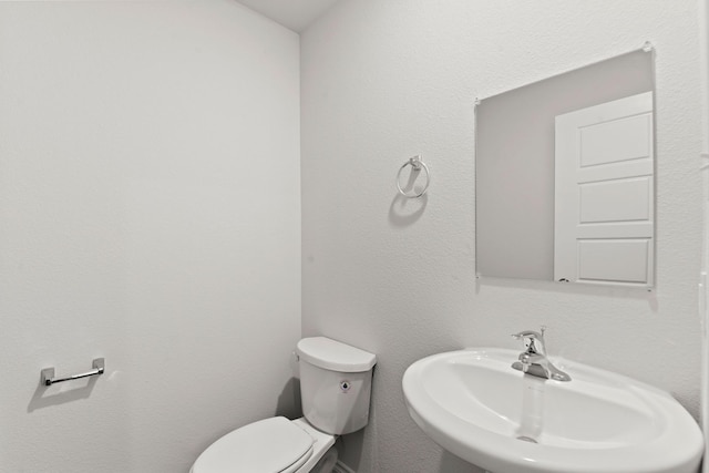 bathroom with sink and toilet