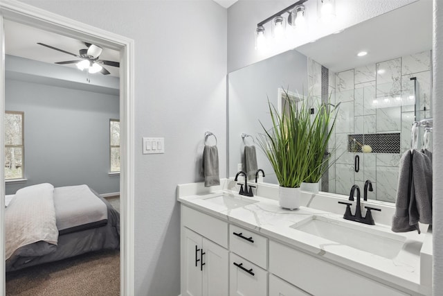 bathroom with ceiling fan, walk in shower, and vanity