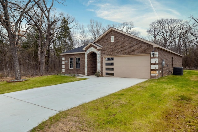 view of front facade featuring central air condition unit, an attached garage, a front yard, and brick siding