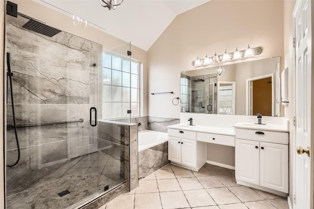 bathroom featuring lofted ceiling, vanity, tile patterned floors, and shower with separate bathtub