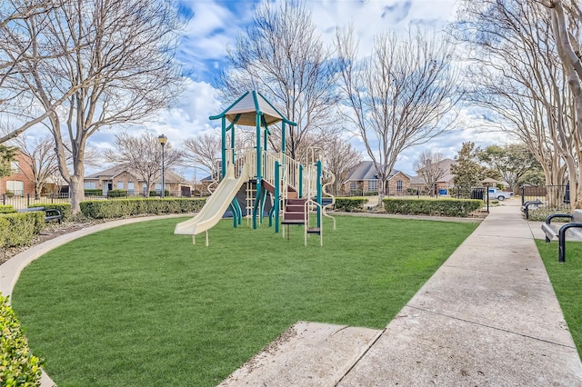 view of playground with a yard