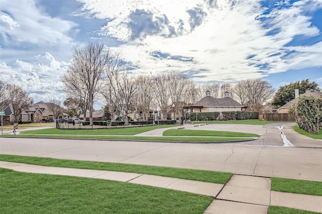 surrounding community featuring a lawn