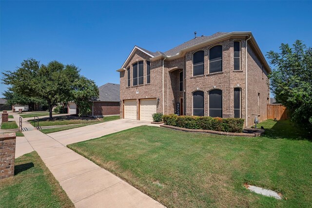 view of front of home with a garage and a front lawn