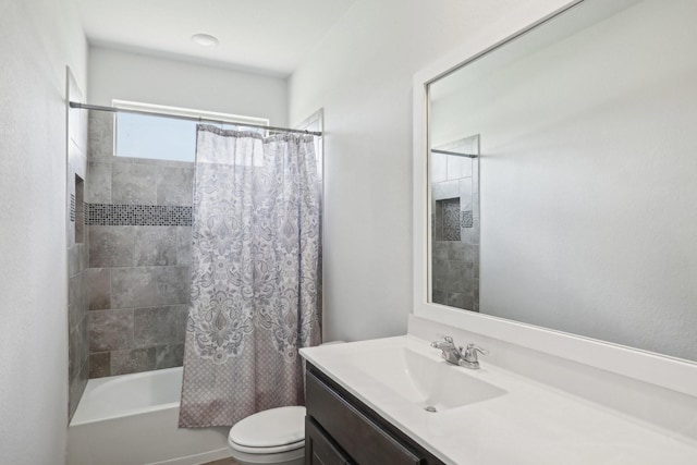 full bathroom featuring toilet, vanity, and shower / tub combo with curtain