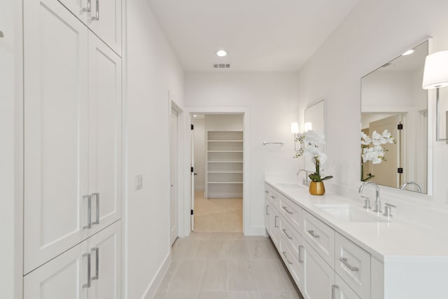 bathroom featuring tile patterned floors and vanity