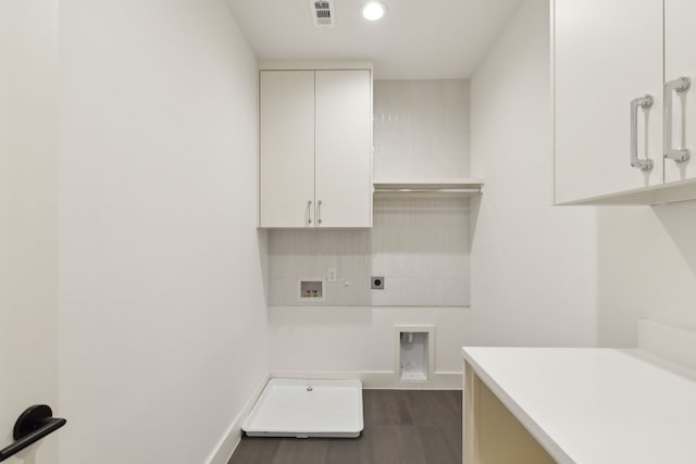 washroom featuring cabinets, gas dryer hookup, hookup for a washing machine, and electric dryer hookup