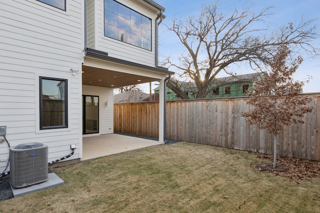 view of yard featuring a patio and central AC