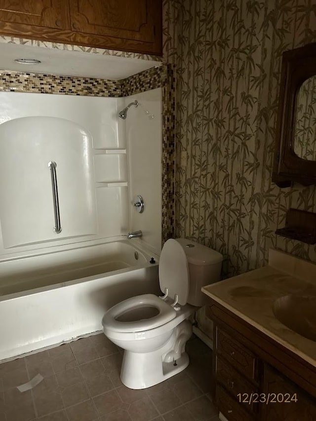 full bathroom with shower / bathing tub combination, toilet, vanity, and tile patterned flooring