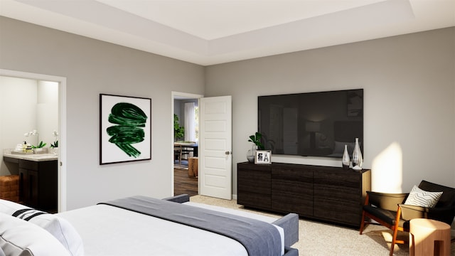 bedroom with light colored carpet, a tray ceiling, and ensuite bathroom