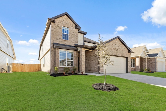 traditional-style home featuring brick siding, an attached garage, and a front yard