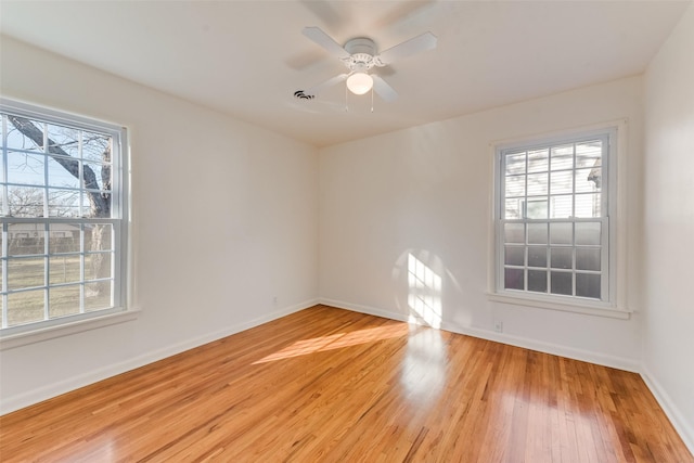 spare room with ceiling fan and light hardwood / wood-style flooring