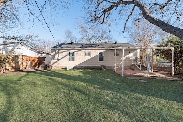 back of house featuring a patio area, central air condition unit, and a lawn