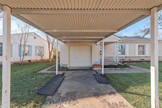 exterior space with a garage, a yard, and a carport