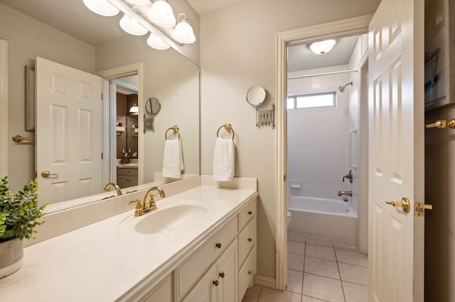 bathroom featuring toilet, shower / tub combination, vanity, and tile patterned floors