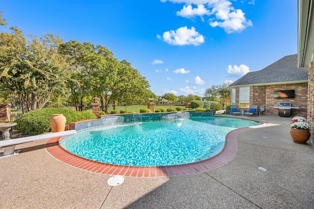 view of swimming pool featuring area for grilling, pool water feature, and a patio