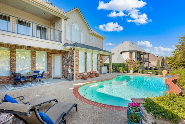 view of pool with a patio, fence, and a fenced in pool