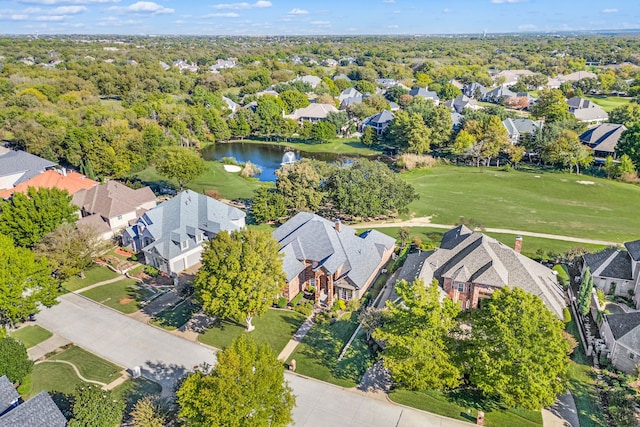 bird's eye view featuring a residential view and a water view