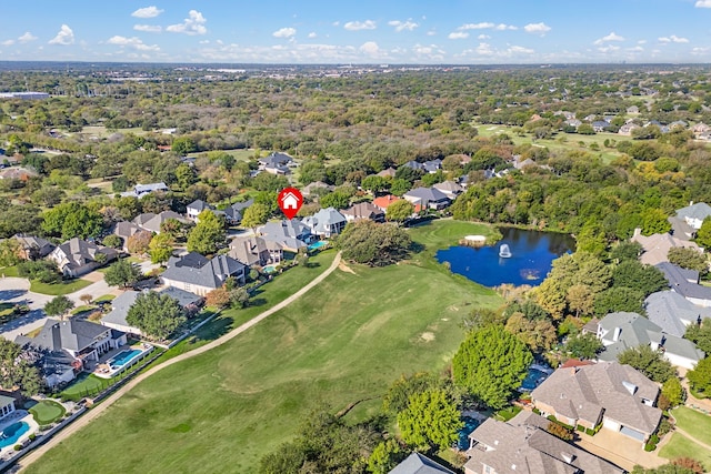 drone / aerial view featuring a water view and a residential view