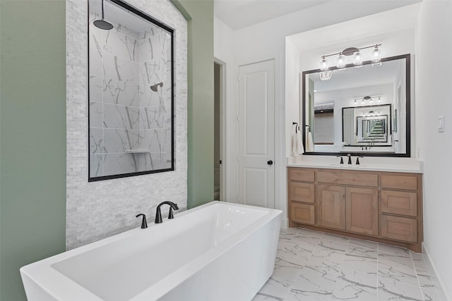 bathroom with baseboards, tiled shower, marble finish floor, a freestanding bath, and vanity