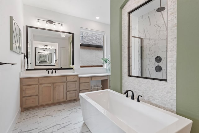 full bathroom featuring a walk in shower, recessed lighting, vanity, a freestanding bath, and marble finish floor