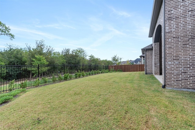 view of yard with a fenced backyard