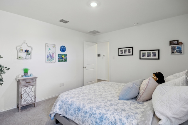 bedroom featuring light colored carpet