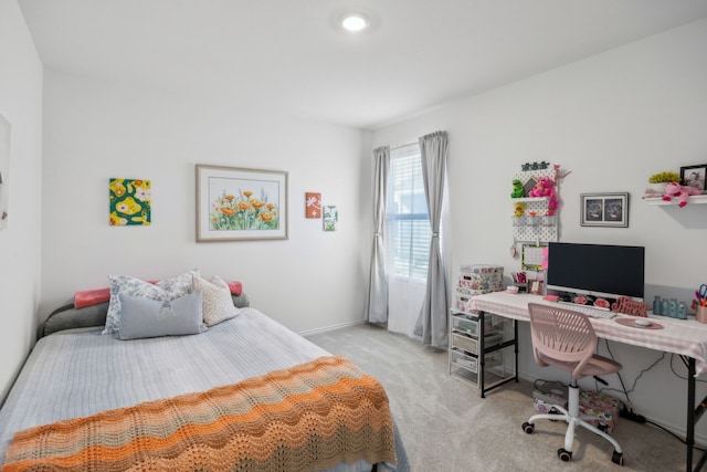 bedroom featuring light colored carpet