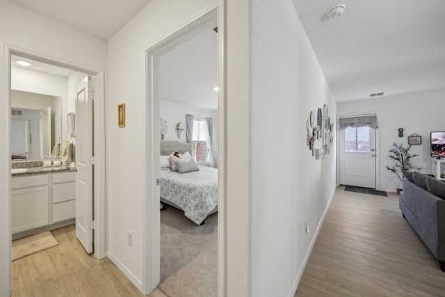 hallway featuring light hardwood / wood-style floors