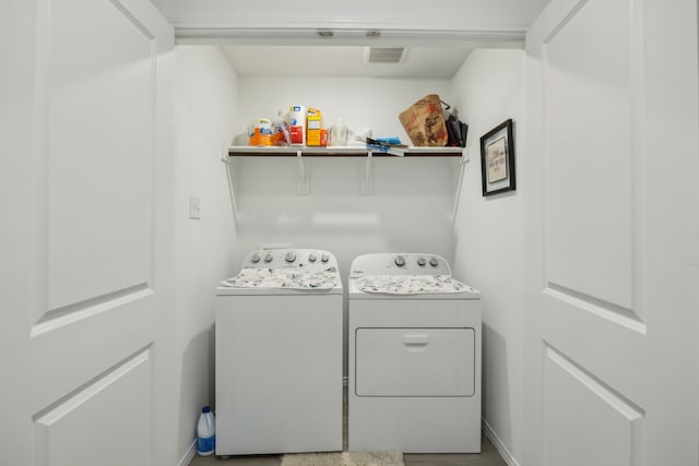 washroom with separate washer and dryer