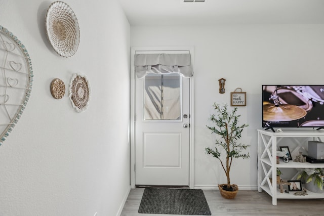 foyer entrance featuring hardwood / wood-style floors