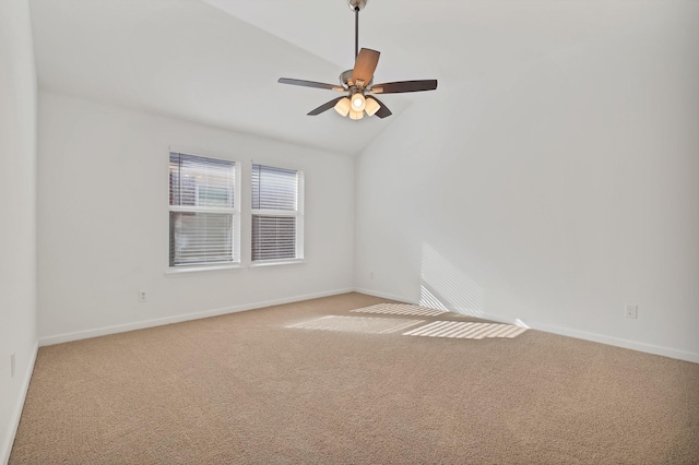 carpeted empty room with lofted ceiling and ceiling fan