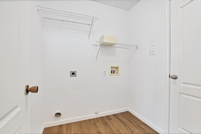 laundry room featuring washer hookup, hookup for a gas dryer, wood-type flooring, and hookup for an electric dryer