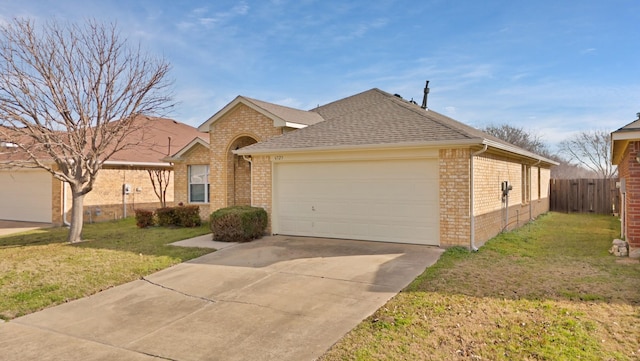 ranch-style house with a garage and a front yard