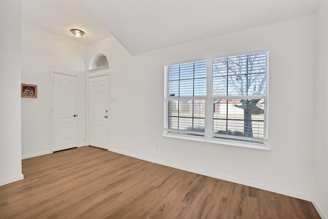 unfurnished room featuring hardwood / wood-style flooring